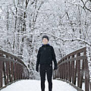 Woman Dressed For Winter Running On Snowy Bridge Art Print