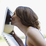 Woman Kissing Laptop Screen Outdoors Art Print