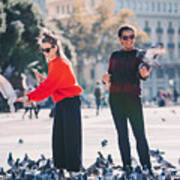 Women Traveling In Europe And Feeding Pigeons In Barcelona Art Print