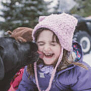 Young Girl With Dog In Snowy Landscape, Dog Licking Girls Face Art Print