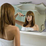 Young Woman Wearing Towel Cutting Fringe In Mirror, Rear View Art Print