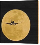 Aeroplane Silhouetted Against A Full Moon Wood Print