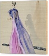 A Model Wearing A Blue Cape And Pink Chiffon Wood Print