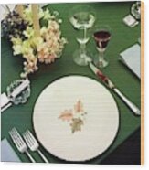 A Table Setting On A Green Tablecloth Wood Print