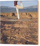A Woman Practicing Yoga On A Dry Lake Wood Print
