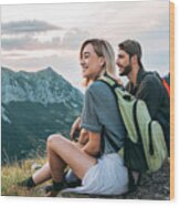 Beautiful Young Couple Relaxing After Hiking And Taking A Break Wood Print