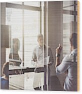 Business People Having Discussion In Board Room Wood Print