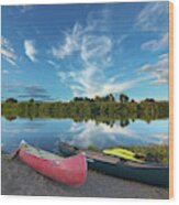 Canoes With Clouds Reflecting Wood Print