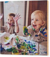 Cheerful Little Children Having Fun Doing Finger Painting Wood Print