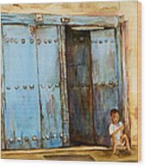 Child Sitting In Old Zanzibar Doorway Wood Print