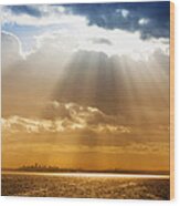 Crepuscular Rays Over City Wood Print