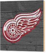 Detroit Red Wings Recycled Vintage Michigan License Plate Fan Art On Distressed Wood Wood Print