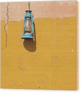 Front View Of A Blue Gas Lamp Hanging Wood Print