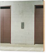 Front View Of Two Elevator Doors Wood Print