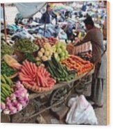 Fruit And Vegetable Seller Tends To His Cart Outside Empress Market Karachi Pakistan Wood Print