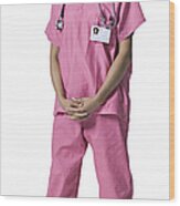 Full Length Portrait Of A Young Adult Female Nurse In Pink Scrubs As She Smiles Wood Print
