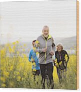 Group Of Seniors Running Outside On The Meadow. Wood Print