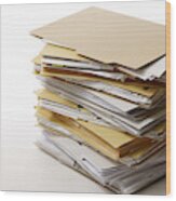 Isolated Shot Of Stacked File Folders On White Background Wood Print