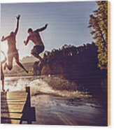 Jumping Into The Water From A Jetty Wood Print