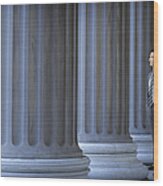Lawyer Or Banker Standing Next To Large Columns Wood Print