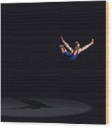 Male Gymnast Soaring Through The Air Wood Print