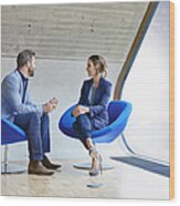 Man And Woman Sitting On Chairs Talking Wood Print