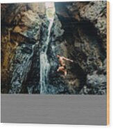 Man Jumping Into Tropical Waterfall Wood Print