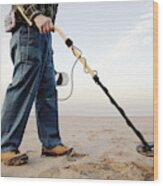 Man Using Metal Detector At Beach Wood Print