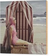 Model In Pink Swimsuit With Tent On Beach Wood Print