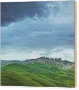 Mountains Under Heavy Clouds Wood Print