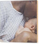 New Mom Holds Her Infant To Her Chest Wood Print