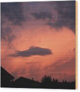 Purple Clouds Gather In A Pink Sky Above Dark Houses Wood Print