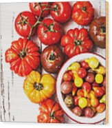 Red And Yellow Tomatoes On White Table Wood Print
