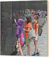 Searching A Loved Ones Name On The Vietnam Veterans Memorial Wood Print