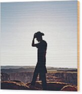 Silhouette Of Hiker With Cowboy Hat Wood Print