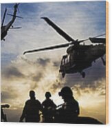 Silhouettes Of Soldiers During Military Mission At Dusk Wood Print