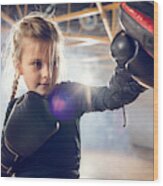 Small Boxer Exercising Punches On A Sports Training In A Gym. Wood Print
