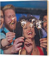 Smiling People Holding Sparklers Wood Print