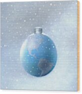 Snow Falling Around Hanging Globe Wood Print