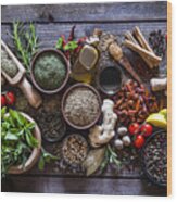 Spices And Herbs On Rustic Wood Kitchen Table Wood Print