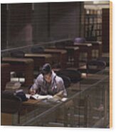 Student Working In Library At Night Wood Print