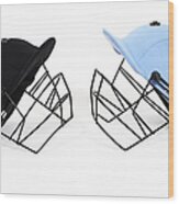 Two Cricket Helmets Facing Each Other Wood Print