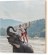 Two Young Women Riding An Elephant In The Mekong Wood Print