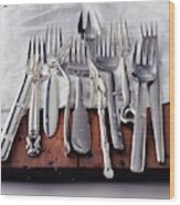 Various Forks On A Wooden Board Wood Print