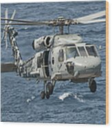 A Us Navy Sh-60f Seahawk Flying Wood Print