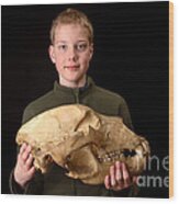 Boy Holding Kodiak Bear Skull Wood Print