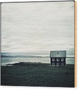 Little Black House By The Sea Wood Print