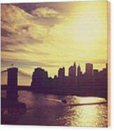 Sunset Over The New York City Skyline And The Brooklyn Bridge Wood Print