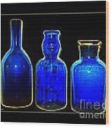 Three Blue Bottles Wood Print