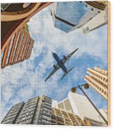 Airplane Above City Wood Print